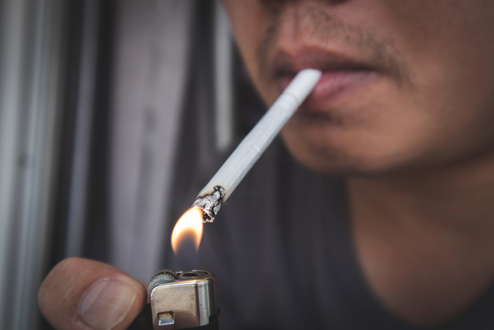male smoker smoking a cigarette