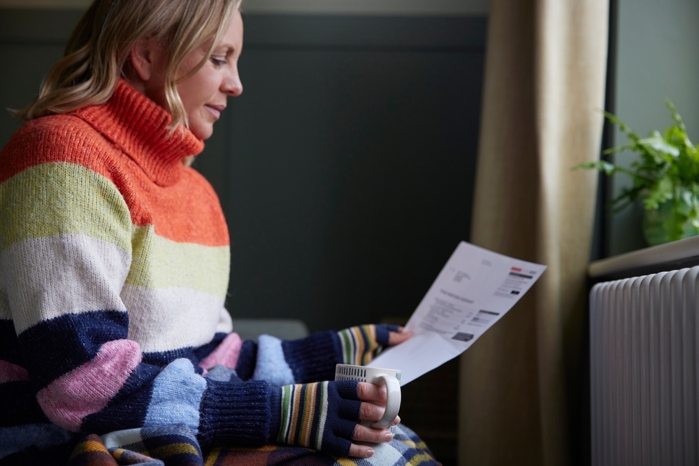 woman struggling with heating bill